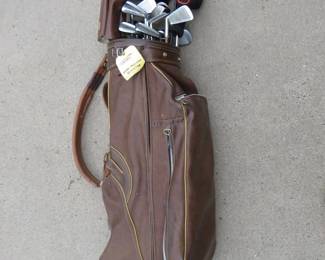 Lot 57. More clubs than its legal to carry (14) in this bag including 5 metal woods, 3 old school woods, 15 irons, and one putter