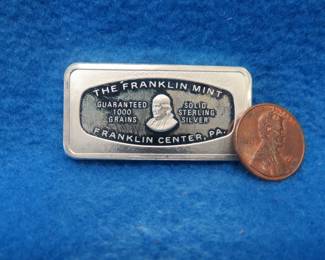 Lot 42. Franklin Mint Bank-marked sterling silver ingot. 65.3 grams.