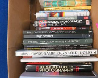 Lot 151. A box of books that cover many topics or interests