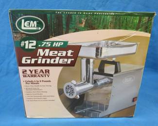 Lot 300. LEM 3/4 HP meat grinder in very good condition. Includes all accessories.