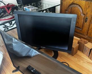 older flat screen from the Stone Age, and lovely newer Samsung flat screen up for grabs