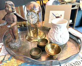 Mantel clocks including glass domed brass clock