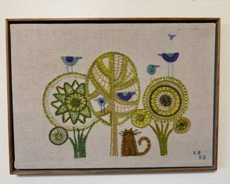 One of several embroidered wall art pieces made by homeowner