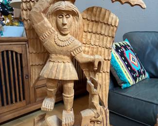 Hand carved folk art attributed to George Lopez from Cordova, NM. The image depicts St. Michael, defeating a demon.