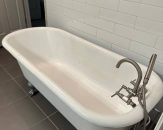 1912 Iron Claw Foot Tub with Fixtures.  50" x 24" Interior. 65" x 29.5" Exterior. 16" Deep.