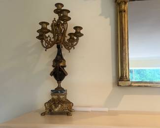 close up of the second candelabra and a view of the mirror detailing.
