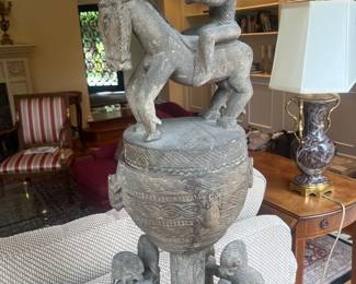 Carved African wooden statue. 13 inch diameter by 36.7 inches high.