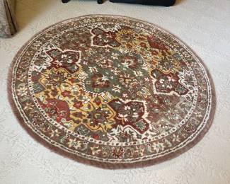 $120 A round oriental rug. 4 feet in diameter.