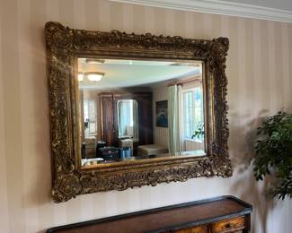 $280. An antique framed mirror. 54.5 inches wide by 44.5 inches high by 5 inches. Can be hung either direction.