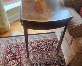 A reproduction George III Pembroke table. Each drop-down leaf is 9.5 inches. The table is 31.5 inches deep by 20.5 inches wide by 28.25 inches high.