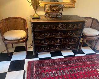 A Baker Furniture Chinoiserie chest of drawers. 48 inches wide by 19 inches deep by 35.25 inches high.
