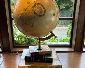 $260. Table top globe on a leather book and metal base. 18"sq. x 30"h.