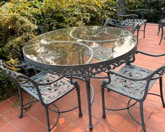 Acryllic top and wrought iron base dining set. Four chairs. 48" diameter x 30"h