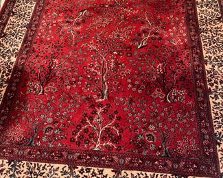 A beautiful antique wool rug. 5'7" x 7' 11"
