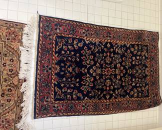 $140. Antique navy wool rug. 2' x 3'1"