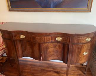 Baker furniture sideboard, lined drawer for silver four more drawers and center cabinet. 72 inches wide by 40 inches high by 25 inches deep.