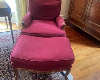 A pair of French walnut and upholstered chairs from Clarence House. One ottoman. each chair is 29.5 inches deep by 28.5 inches wide by 35 inches high. The ottoman is 20.5 inches deep by 28.5 inches wide by 17.25 inches high.