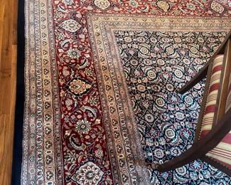 A vintage Oriental rug. 14‘7“ by 11‘7“.