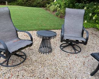 Tropitone pair of swivel chairs. Table shown in separate photo.