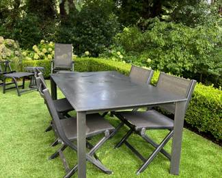 Kettler table with four folding mesh chairs. 63"w x 37.5"d x 29"h.