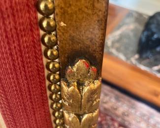 A close-up of the carved detailing on the chairs.