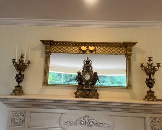 Antique Louis the XIVth style mantle clock. Clock is 24"h x 14"w x 8"d. Candelabras are each 24"h x 7"w x 6"d.