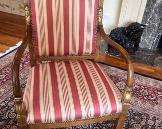 A pair of French upholstered armchairs. 25 inches wide by 21 inches deep by 38 inches high.