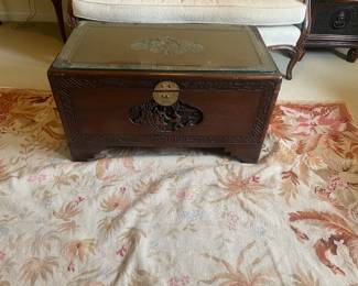 $180. Carved Asian chest with glass top. 35 inches wide by 19.5 inches deep by 19 inches high.