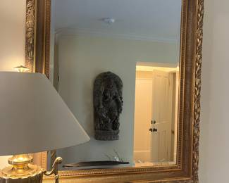 Gold carved antique mirror. 38 inches wide by 48 inches high by 2.5 inches deep.