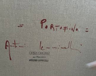 signature and stamped name on the back of the art