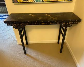$340. Hand painted black Laqueur console. 47 inches wide by 14 inches deep by 31.5 inches high.