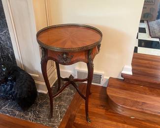 Antique brass rail rimmed table. 30.5" h x 20.25" diameter.