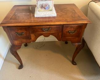 $265. An antique table with drawers and wooden inlay on the top 31.5 inches wide by 19 inches deep by 28 inches high.