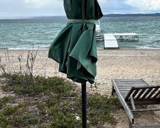 Pair of green patio umbrellas