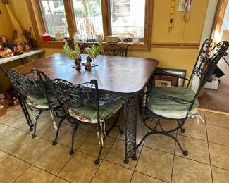 (6) Iron chairs and wood topped iron base table