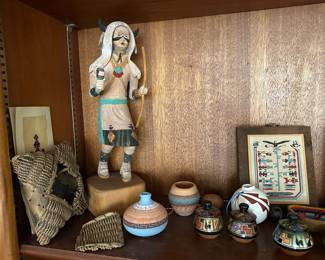 Kachina figure and Native American pottery