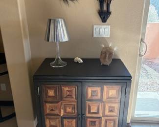 Small MCM inspired cabinet with 'Miss KT' lamp designed by Philippe Starck