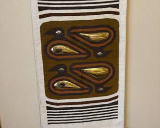 Handweaving with brass birds