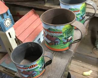 38. Metal painted cans or cups