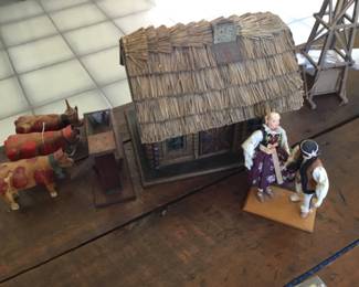 362. log cabin, bulls and cow with milking stool on head, 