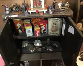 166. miniature tins, display case.