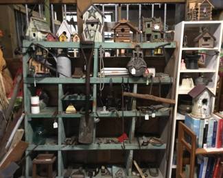 112. large display case of Knick knacks, small tools, bird houses.