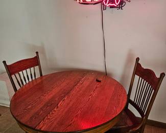 406. Table with 2 chairs, neon sign