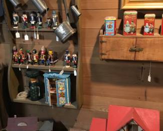 168. nutcrackers, tins, barn set.