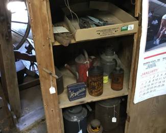 207. metal cans, oil cans, display case