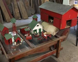 55. large farm set.  Table under set is for sale too as well as toy rocking duck