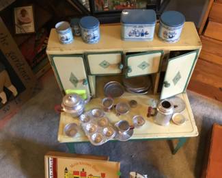 291. toy kitchen set with dishes and containers.