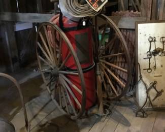 246. vintage fire hose and rolling tank