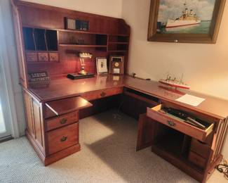 Solid cherry Desk with multiple storage compartments and hutch top.