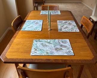 Vintage dinning room set includes 4 chairs and 2 leaves. Check out the matching dining cabinet that can be included or sold separately. 